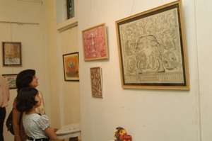 Visitors looking at the artworks at Artfest 09, Indiaart Gallery